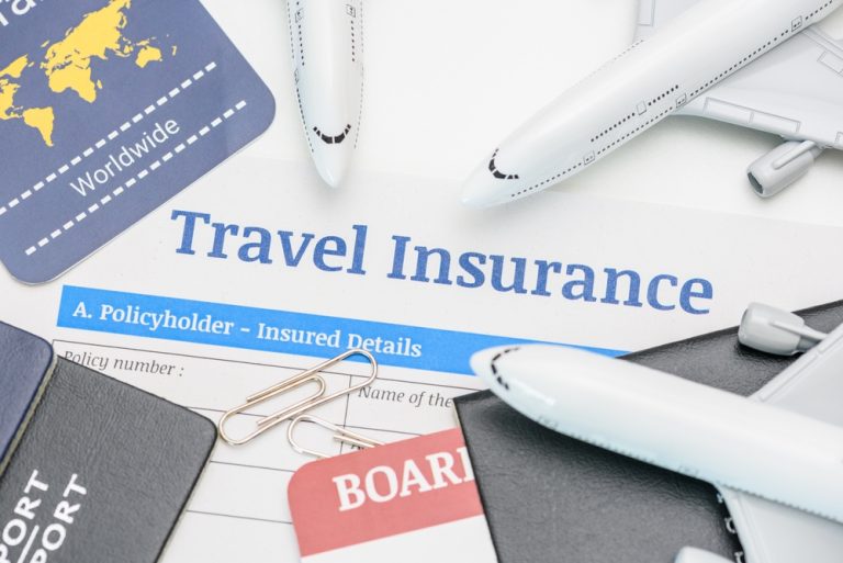 TravelInsuranceAndServiceConceptTopViewOfTravel - Mann Travel